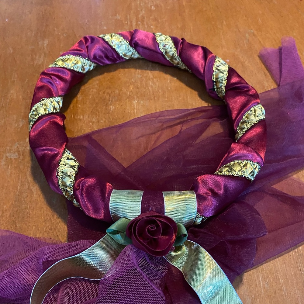 Burgundy and gold headpiece
